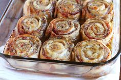 a glass baking dish filled with cinnamon rolls