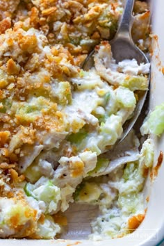 a casserole dish with broccoli, cheese and bread crumbs