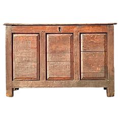 an old wooden cabinet with three drawers on one side and two doors on the other