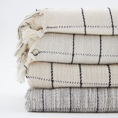 three blankets stacked on top of each other