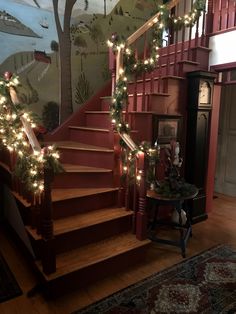 the stairs are decorated with christmas lights and garlands