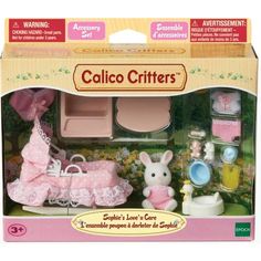 a toy doll house set with accessories in the box, including a baby's stroller