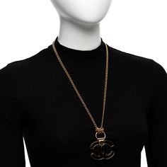 This is an authentic CHANEL Metal Resin CC Pendant Necklace in Gold and Brown. This stylish necklace is crafted with gold chain links and a brown resin CC logo. Pendant Necklace Gold, Stylish Necklace, Chain Links, Cc Logo, Gold Pendant Necklace, Necklace Gold, Brown Gold, Gold Chain, Chain Link