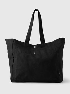 Smooth linen-cotton blend tote bag.  Shoulder straps at top.  Patch pocket at front.  Buttons at center.  Dimensions: 14. 57 L x 7. 48 W x 14. 96 H Black Tote, Black Tote Bag, Cotton Totes, Bag Shoulder, Cotton Tote Bags, Patch Pocket, Shoulder Straps, Gap, Cotton Blend