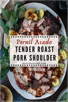 the tender roast pork shoulder is served on a white plate with green leaves and potatoes