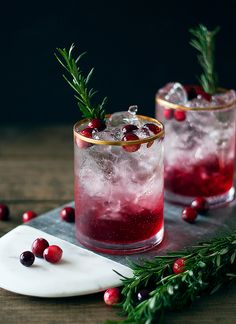 two glasses filled with cranberry shrub cocktail