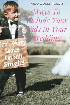 a little boy holding a sign that says, ways to include your kids in your wedding