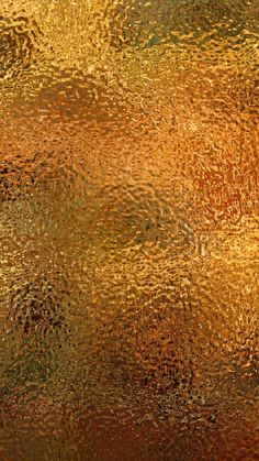 an abstract background with gold and green colors photo - textured glass, closeup