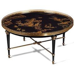 a black and gold coffee table with dragon designs on it