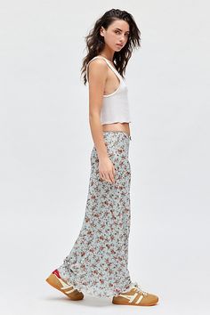 Vintage-inspired UO skirt in a body-skimming maxi silhouette. Designed in a soft & stretchy floral printed mesh featuring a low-rise waistline that sits at the hips topped with a satin bow detail & finished with a ruffled lettuce-edge hem. Exclusively at Urban Outfitters. Features UO floral mesh low rise column maxi skirt Floral slip maxi skirt Soft & stretchy floral print mesh Low-rise elasticated waistline Satin bow detail at center front Ruffled lettuce-edge trimmed hem Slim, body-skimming si Skirt Floral, 2024 Christmas, Floral Maxi Skirt, Blue Fits, Women Men Shoes, Satin Bow, Bow Detail, Floral Printed, Christmas List