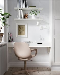 a white desk with a chair and bookshelf in the corner next to it