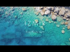 an aerial view of rocks and water with the words izmr written in white