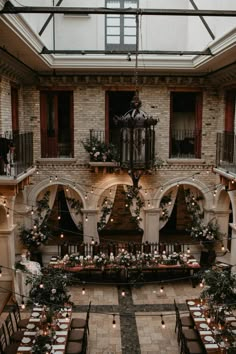 an indoor wedding venue with tables and chairs set up for the guests to sit down