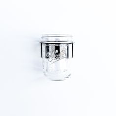 an empty glass jar on a white background