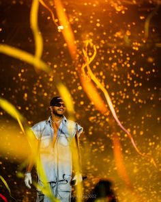 a man is standing in front of some streamers