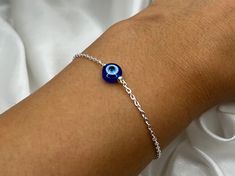 Please note, your bracelet may contain a 2" extension chain 🥰❣️ Save when you shop through my website, I'd appreciate it 💚- https://shorturl.at/dGU49 ✨check out the rest of my jewellery here - https://etsy.me/3nxyN99 ✨ Wear a stunning gold Evil Eye bracelet for protection, luck & good fortune 💓✨.  🤍 Made with Tarnish Resistant Stainless Steel 🤍 Packaged in reusable organza bag  🤍 Recyclable Packaging  The evil eye is and has been a powerful symbol for spiritual protection from evil eye, ne Adjustable Blue Evil Eye Bracelet, Evil Eye Bracelet Silver, Blue Evil Eye Metal Bracelet, Adjustable Blue Evil Eye Bracelet Hand-strung, Blue Bohemian Evil Eye Bracelet Hand-strung, Adjustable Nickel-free Blue Evil Eye Bracelet, Devil Eye, Blue Aesthetic Pastel, Spiritual Protection