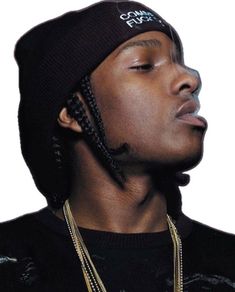 a young man wearing a black hat with braids