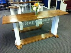 a wooden table sitting in the middle of a room