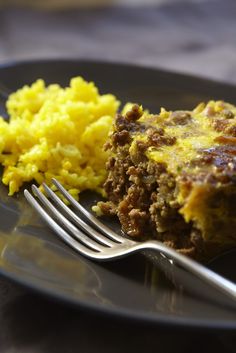 a plate with some food and a fork on it