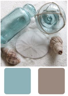 the color scheme is blue, brown and white with some sea shells on top of it