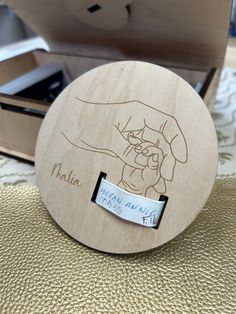 a close up of a wooden object with a hand drawn on the inside of it