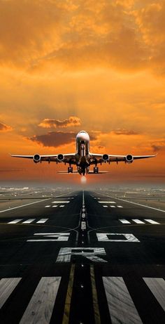 an airplane is taking off from the runway at sunset or dawn, with clouds in the background