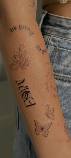 a woman's arm with butterflies and the words hello written on it, in cursive writing