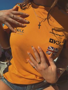 Mclaren Garage F1, Mclaren Shirt Outfit, Mclaren Girl Aesthetic, F1 Aesthetic Mclaren, Mclaren Clothes, Redbull F1 Aesthetic, Mclaren Nails, Mclaren Outfit, Mclaren Girl