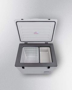 an ice chest is shown with the lid open to show it's inner compartment