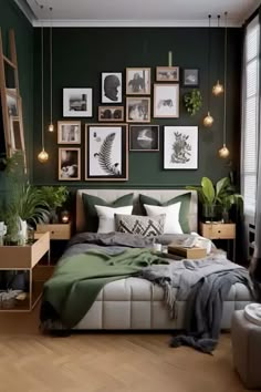 a bedroom decorated in green and white with pictures on the wall above the bed, as well as plants