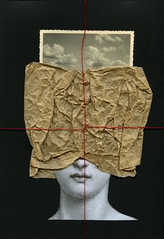 a woman's head with a piece of paper covering it over the top of her face