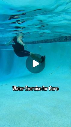 a woman is swimming in the water with an exercise for core ball on her back