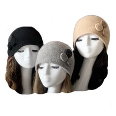 three mannequin heads with hats on them