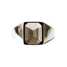 This minimalist signet ring has a carved out emerald cut gemstone shape in the middle.    The sculptural design plays with light and shadow, creating the illusion that a faceted gem is set in the unoccupied space.  You’ll never tire of admiring its clean lines and classic yet modern form.  The ring has a good weight to it, its designed for men and women, and can be worn on the main finger or as a pinky ring.  The ring is made of recycled sterling silver. All No 13 jewellery is made from recycled sterling silver. When not being worn, we recommend that you store your jewellery in the box that it came in. This will minimise the effects of sunlight and the environment. Avoid all contact with water, body lotions, perfumes, sun creams, cleaning products and make-up To keep your jewellery sparkli