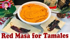 red masa for tamales in a white bowl surrounded by other foods and decorations