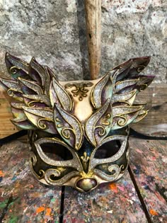 One of a kind mask with a wonderful floral decoration. Elegant cat mask decorated with baroque friezes and glitter. -Material/Resin and paper mache Made in Italy, hypoallergenic and non-toxic. -Dimensions/18x18 Unisex -History of the mask/a double legend intertwines the fate of this cat-like mask. From ancient texts it appears to have been a "Sacred" animal for the city of Venice as it would have saved it from the terrible plague of the 16th century by managing to defeat the rats that carried th Venetian Masks Art, Italian Masks, Elegant Cat, Venetian Masquerade, Masquerade Masks, Venetian Masks, Floral Decorations