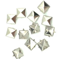 silver pyramid studs on white background