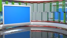 a television set with a blue screen in front of a spiral staircase and glass railing