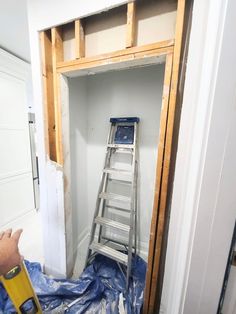 a ladder is being installed in the corner of a room