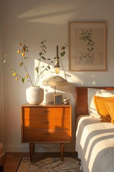 a bedroom with a bed and two vases on the nightstand next to each other