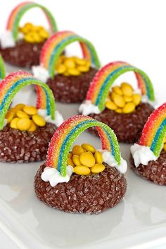 the cookies are decorated with rainbows and marshmallows on top of them