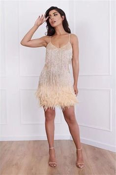 Feather Flapper Dress - Gold Be the life of the party in this roaring 20's vibe ruffle tiered feather mini dress! Champagne Dress, Stitching Dresses, Dress Beige, Panel Dress, Feather Dress, Asymmetrical Skirt, Gold Dress, Strap Dress, Types Of Skirts