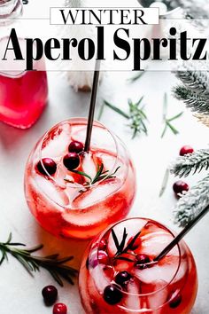 winter aperol spritz cocktail with rosemary garnish and ice in glasses