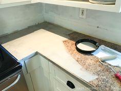 a kitchen counter with a bowl on top of it