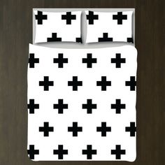 a bed with black and white crosses on it