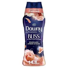 downy deodorant spray with pink roses on the front and blue cap