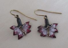 Vintage Thousand Flowers enamel over sterling silver floral earrings.  The delicate earrings about 1" long by almost 5/8" at the widest point and have gold vermeil over the sterling silver.  They are lavender-pink in the center of the flowers with darker lavender on the outside of the petals.  "Silver" is embossed on the back of one of the earrings. Big Funky Earrings, Antique Earrings Vintage, Flower Shaped Enamel Jewelry For Pierced Ears, Handmade Vintage Dangle Flower Earrings, Silver Vintage Flower Earrings, Vintage Metal Flower Earrings, Vintage Silver Flower Earrings Pierced, Vintage Metal Dangle Flower Earrings, Nickel-free Enamel Flower Jewelry