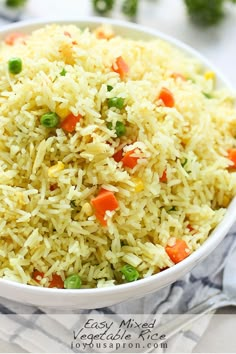 a white bowl filled with rice and vegetables