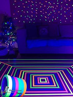 a living room filled with furniture and colorful lights on the wall above it's carpet