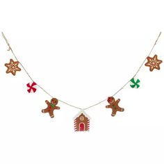 gingerbread christmas decorations hanging from a line on a white background with snowflakes